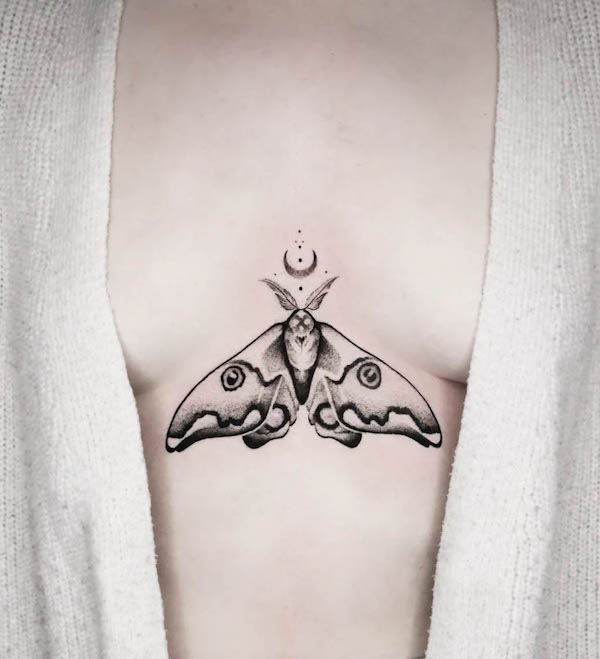 Moon and moth between the boobs tattoo by @kamatatuaz