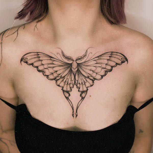 Bold luna moth chest tattoo by @kisielowy_chaos_art