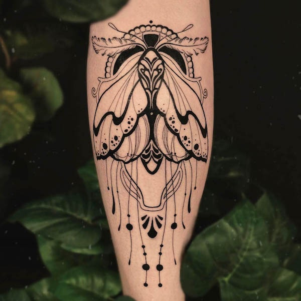 Bold blackwork moth tattoo by @madame._.medusa