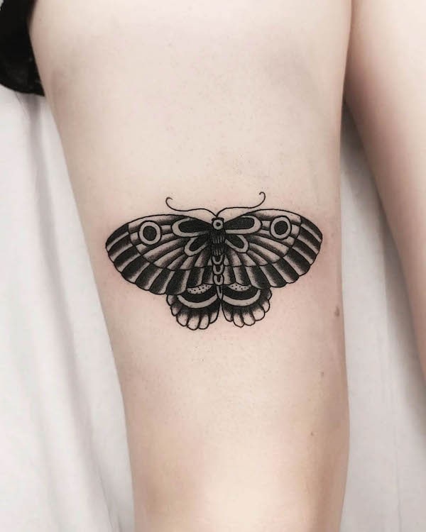Simple black traditional moth tattoo by @oriolzambudiotattoo