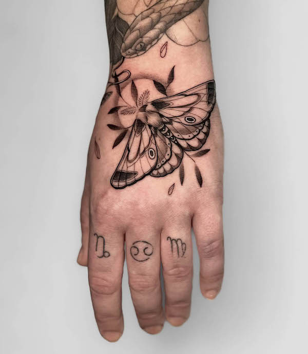 Moth hand tattoo by @victoria.tattoos
