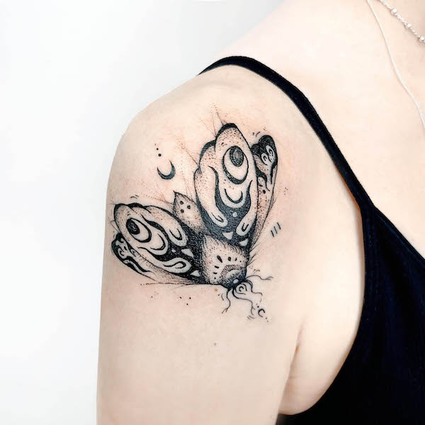 Stunning moth shoulder tattoo by @negerda.tattoo