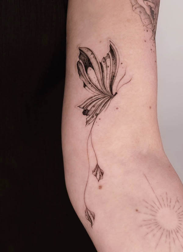 Fine line moth arm tattoo by @linda.tattooing