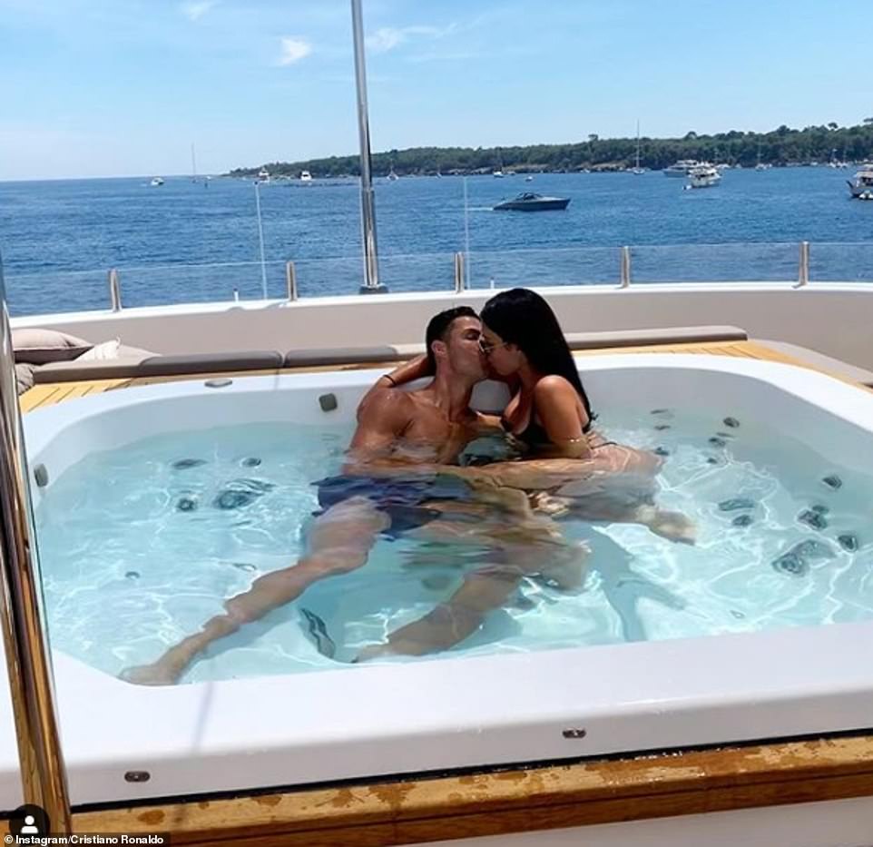 Steamy: Throughout their enviable stay, Cristiano has shared snippets of their trip including a very steamy snap of himself and stunning partner Georgina, 25, locking lips in the boat's hot tub