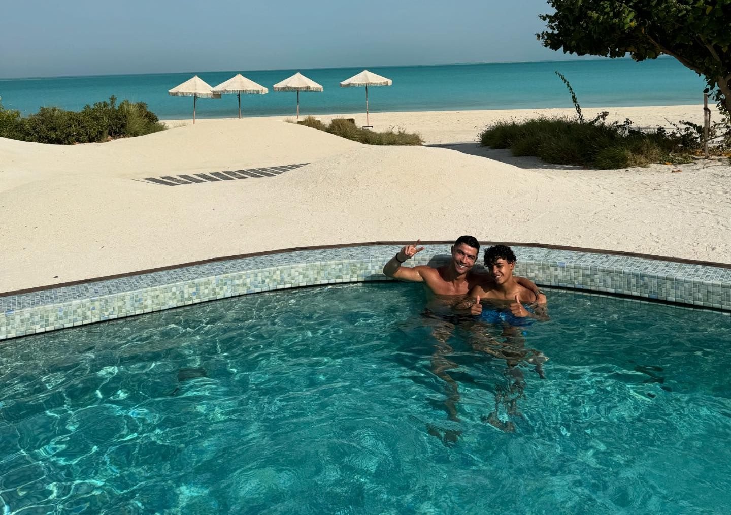 Cristiano relaxed in the pool with his eldest son Cristiano Jr