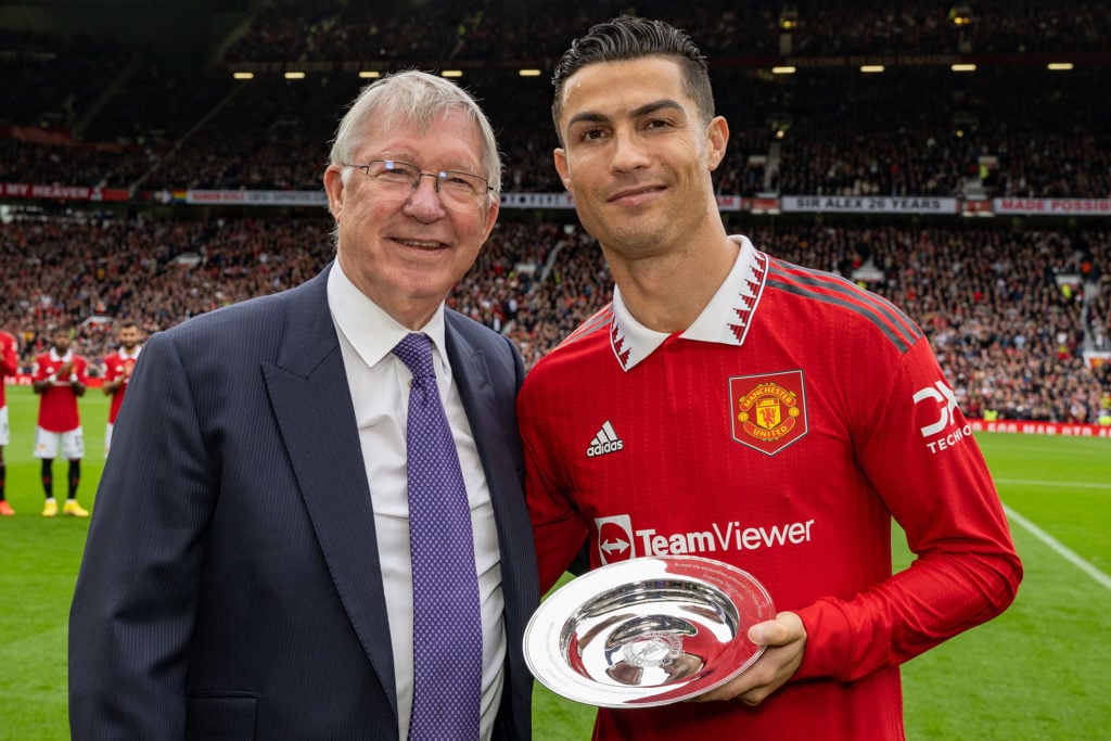 Former Manager Sir Alex Ferguson congratulates Cristiano Ronaldo of Manchester United on scoring his 700th club career goals ahead of the Premier L...