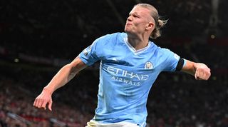 Manchester City Cristiano Ronaldo striker Erling Haaland celebrates after scoring a penalty against Manchester United at Old Trafford.