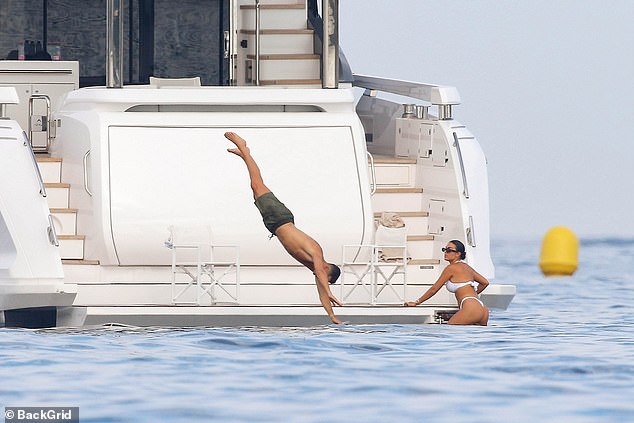 Ronaldo leapt into the ocean with a graceful swan dive as Georgina watched on