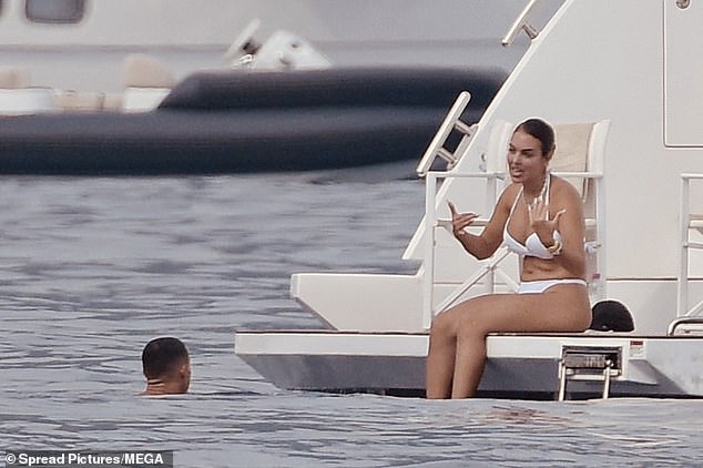 Georgina was having an animated discussion with Ronaldo as he swam along