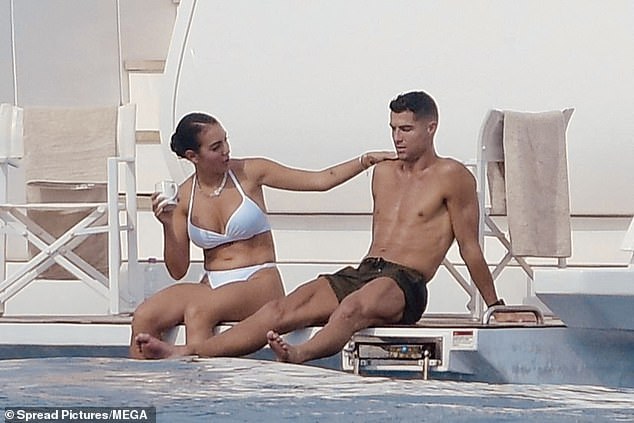 Cristiano Ronaldo couldn't keep his hands off Georgina Rodriguez on Saturday as they enjoyed a luxury yacht trip in Saint-Tropez amid rumours they've secretly tied the knot