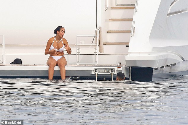 Georgina chatted away to Ronaldo as he enjoyed a swim